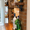 How to Build a Man Cave Bar and Shelf Wall That Holds Real Weight
