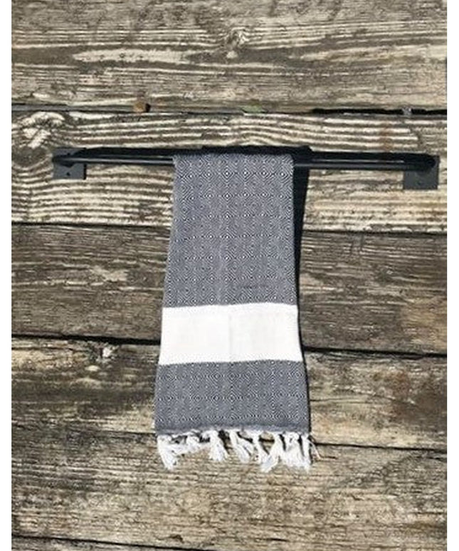 Industrial Farm Co Split Rock black metal towel rack mounted on weathered wood wall with gray and white striped towel