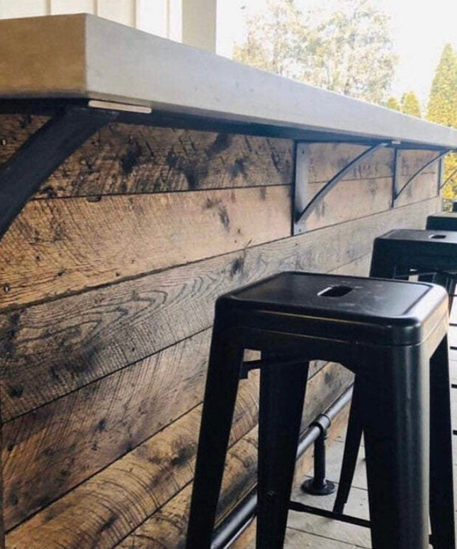 Black industrial steel shelf brackets supporting reclaimed wood counter with metal bar stools - Albany 4 inch curved suppo...