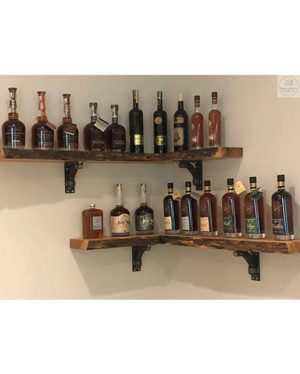 Black metal shelf brackets supporting rustic wood shelves displaying whiskey bottles - The Butch Shelf Supports by Industr...