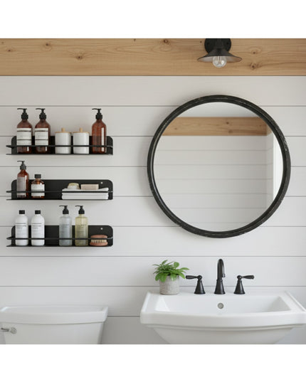 Matte black metal wall mounted bathroom shelves holding toiletries and bottles in modern farmhouse bathroom with shiplap w...