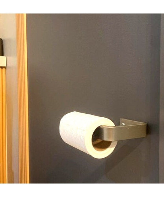 Manlius minimalist stainless steel toilet paper holder mounted on gray bathroom wall with white toilet paper roll by Indus...