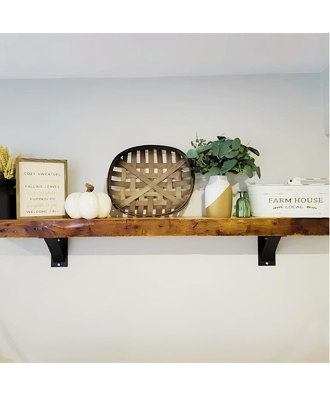 Heavy duty black steel industrial shelf brackets supporting rustic wood floating shelf with farmhouse decor - Industrial F...