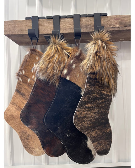 Industrial Farm Co Annie Stocking Holder with four fur Christmas stockings hanging from rustic wood beam with black metal ...