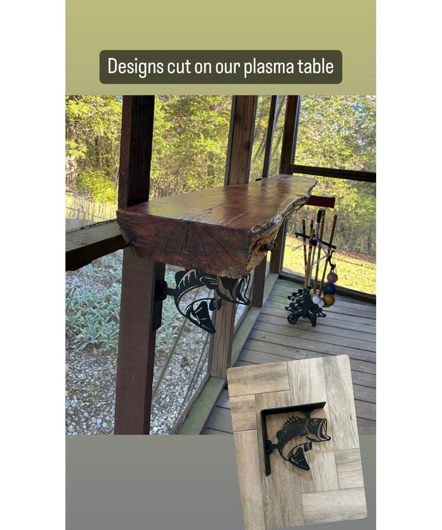 Black metal fish-shaped shelf brackets cut with plasma table, displayed on rustic wooden shelves in outdoor cabin setting ...