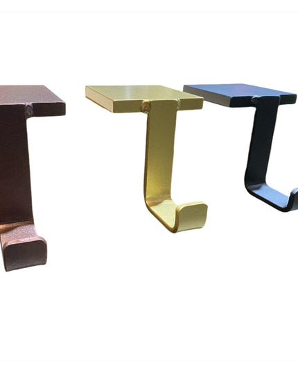 Three Annie Stocking Holders by Industrial Farm Co in copper, brass, and black finishes, C-shaped metal hooks for hanging ...