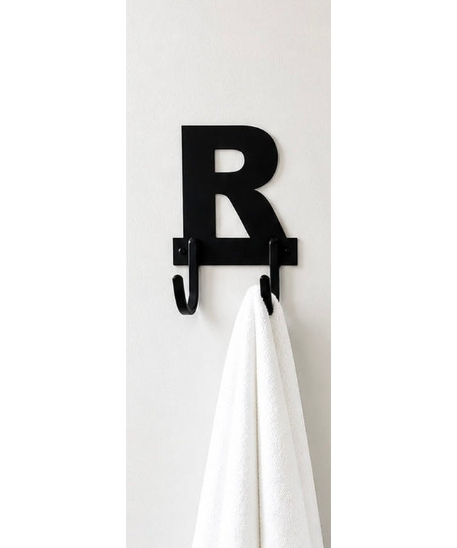 Black metal letter R wall hook with two hanging hooks holding white towel on white wall - Industrial Farm Co personalized ...