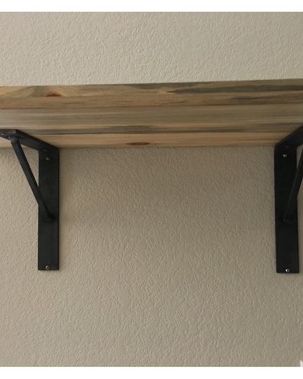 Industrial Farm Co Oneida black metal shelf brackets supporting natural wood floating shelf mounted on textured beige wall