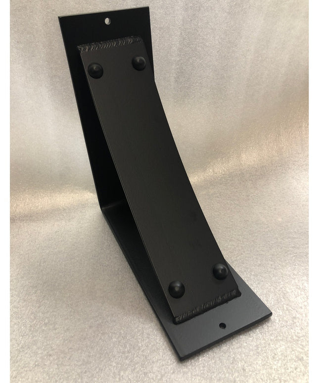 Black metal Utica Support bracket by Industrial Farm Co with curved L-shape design and riveted details on neutral background