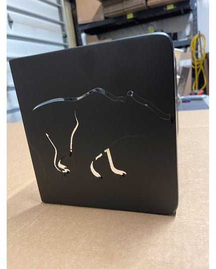 Black metal Vandiver Bear Mantel End Cap by Industrial Farm Co featuring cut-out bear silhouette design on wooden surface