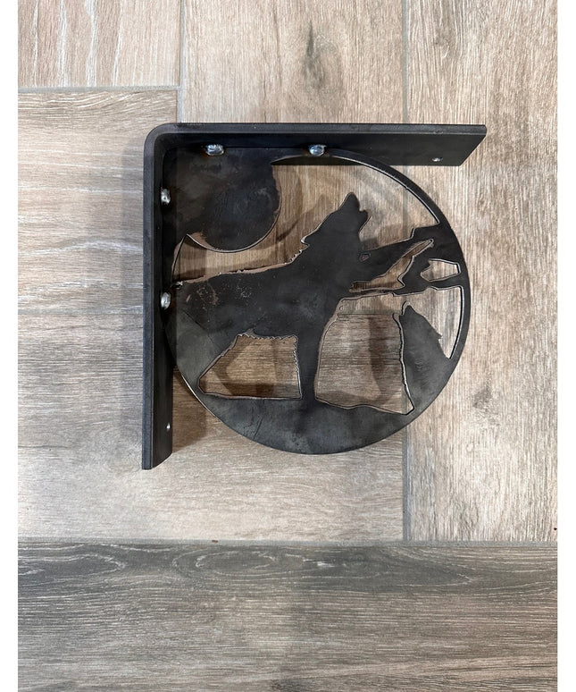Black metal wolf silhouette shelf bracket by Industrial Farm Co, handcrafted decorative support with circular cutout desig...