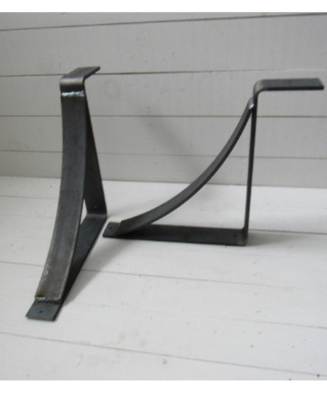 Black metal Marietta shelf bracket corbels by Industrial Farm Co with curved support design on white wood background