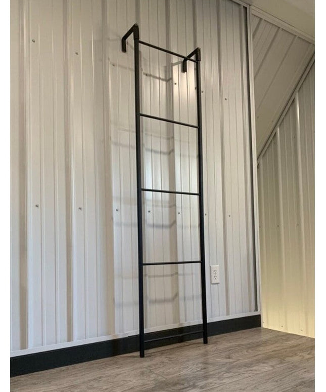 The Hal Standing Mounted black metal blanket ladder by Industrial Farm Co mounted on white shiplap wall in modern farmhous...