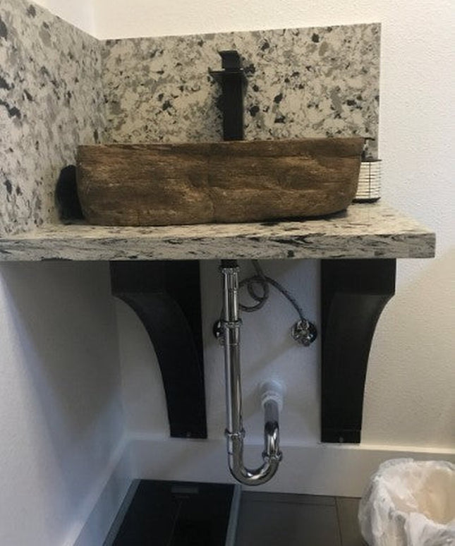 Rustic wooden vessel sink basin with natural stone backsplash and black metal bracket supports from Industrial Farm Co