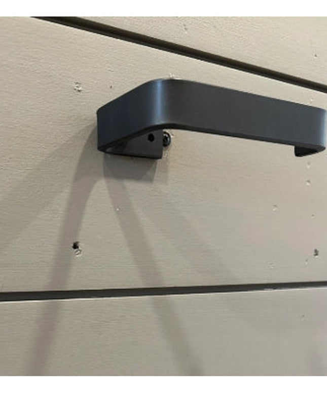 Black minimalist toilet paper holder mounted on white shiplap wall - The Manlius design by Industrial Farm Co