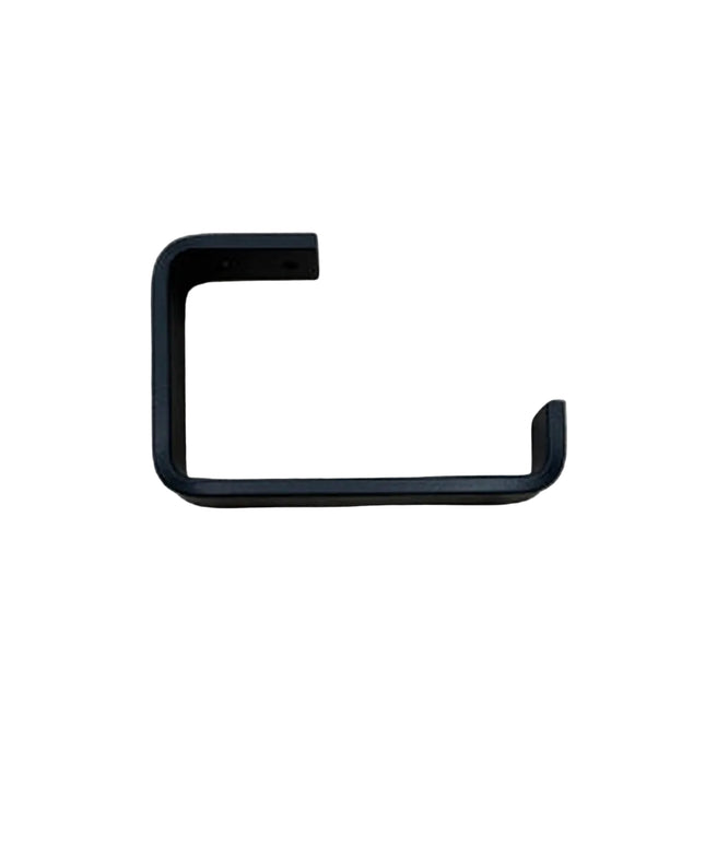 Black minimalist toilet paper holder from Industrial Farm Co mounted on light wood grain wall showing clean geometric L-sh...
