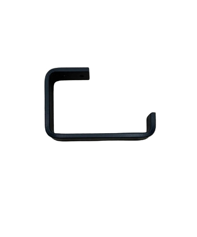Black minimalist toilet paper holder from Industrial Farm Co mounted on light wood grain wall showing clean geometric L-sh...