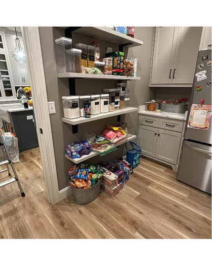Modern white kitchen pantry with floating shelves supported by heavy duty steel brackets, organized with food containers a...