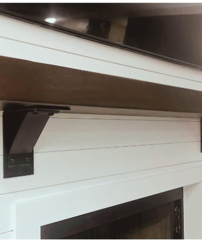 Black metal Ithaca Rustic Bracket Support by Industrial Farm Co mounted on white shiplap wall supporting wooden shelf
