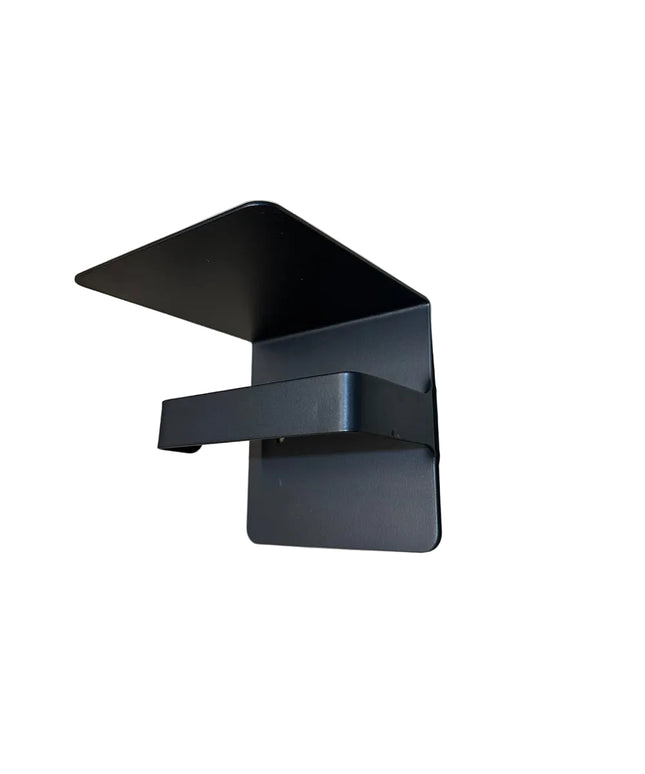 Black metal Cazenovia toilet paper holder with shelf by Industrial Farm Co mounted on white wall, featuring modern industr...