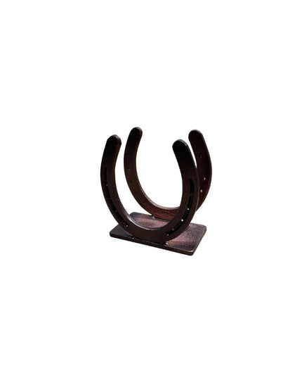 Industrial Farm Co dark brown cast iron horseshoe napkin holder with dual upright horseshoes on rectangular base