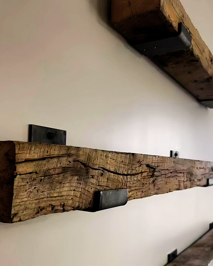 Wooden beams and shelves on a white wall