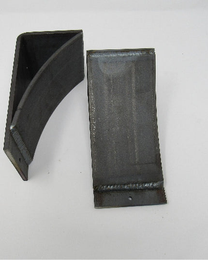 Black metal Tipp Hill Mantel Support brackets by Industrial Farm Co, showing two L-shaped corbels with welded construction...