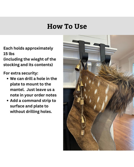 Brown fur Christmas stocking with bells hanging from black Industrial Farm Co Annie Stocking Holder mounted on white firep...