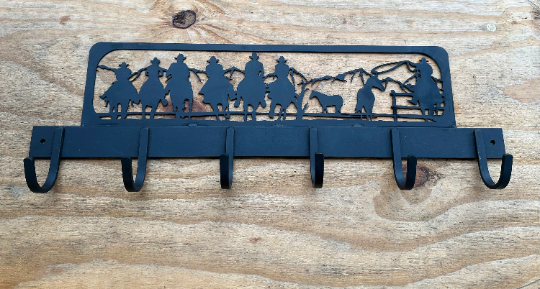 cowboy theme cutout with hooks welded on it for coats