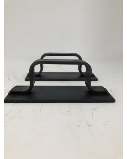 Black cast iron Lockport Pull door handle with curved design and mounting plate by Industrial Farm Co displayed on white m...